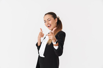 Wall Mural - Photo of funny businesswoman winking and pointing fingers at camera
