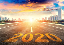 Straight Ahead To The Modern City With The New Year 2020 Concept. The 2020 Number Written In Modern Cities.
