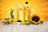Fototapeta Zwierzęta - Healthy oil from sunflower, olive, rapeseed oil. Cooking oils in bottle