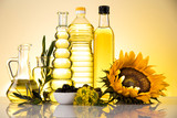 Fototapeta Zwierzęta - Healthy oil from sunflower, olive, rapeseed oil. Cooking oils in bottle