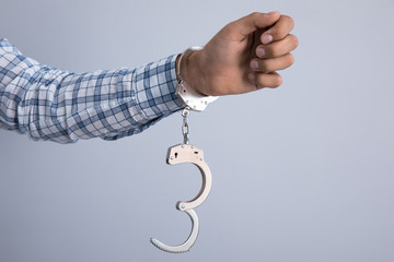 Sticker - handcuffs on a hand