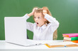© Ermolaev Alexandr - Shocked girl watch on screen of the laptop. Internet safety concept
