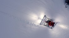High Above Snow Grooming Machine At Ski Resort Aerial Top Down Shot