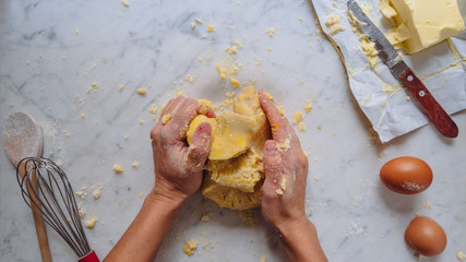 making dough, caucasian woman hands making a dough with flour eggs and butter. homemade pastry. white background 4