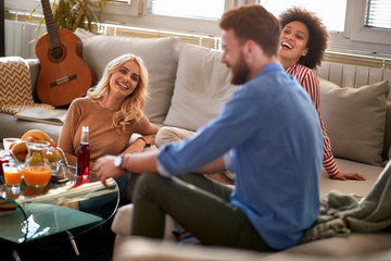 Wall Mural - Friends having fun at home together