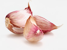 Set Of Red Garlic Cloves. Isolated On White Background
