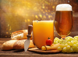 Fototapeta  - Piece of cheese and baguette with fruits for sandwich and beer