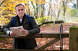 © Daisy Daisy - Active Mature Man With Map Walking Through Autumn Woodland In Slow Motion
