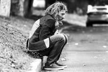 Black And White Portrait Of Poor Homeless Man Outdoors