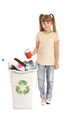 Wall Mural - Little girl and container with trash on white background. Concept of recycling