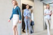 © MDBPIXS - Business professionals walking out of elevator in office