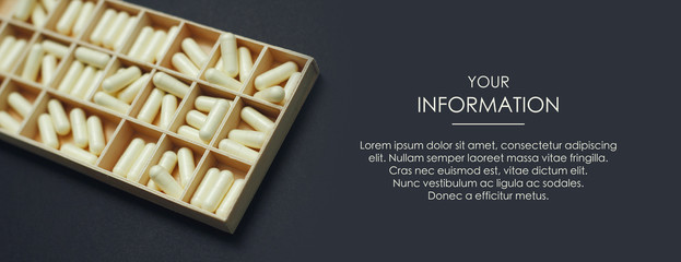 Wall Mural - Box with a daily dose of pills. Medical conception. First Aid Kit. Web article template. Long header banner format. Sale coupon. Visit card. Your information. Text space.