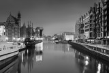 Fototapeta  - Gdansk with beautiful old town over Motlawa river at night in black and white, Poland.