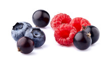 Black currant berries with raspberries and blueberries on White Background isolated. Macro.