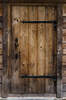 © lizaveta25 - Old door from wooden boards to the bathhouse.