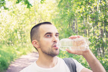 Traveler Drinking From A Bottle Of Water, Portrait, Close Up, Toned