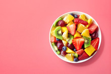 Fresh Fruit Salad On Pink Background