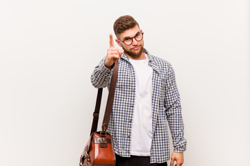Wall Mural - Young modern business man showing number one with finger.