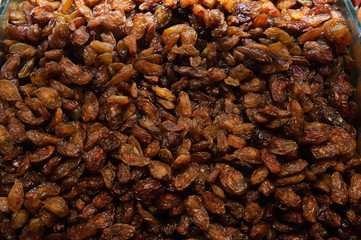 Large brown raisins top view.