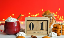 Wooden Calendar 1 JANUARY With Christmas And New Year Decorate On Red Background,wooden Numbers 2020 With Bokeh New Year's Lights.The Concept Of The New Year, New Year's Eve, Winter Holidays.
