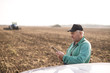 © bugarskipavle3 - Modern senior farmer using tablet on the field