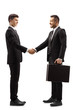 © Ljupco Smokovski - Young man in a suit shaking hands with a businessman