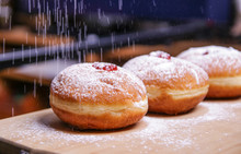 Hanukkah Food Doughnuts With Jelly And Sugar Powder With Bookeh Background. Jewish Holiday Hanukkah Concept And Background. Copy Space For Text. Shallow DOF
