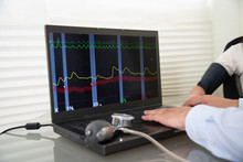 Woman In Polygraph Test With Measuring Devices To Know The Truth, Scales, Hoses And Measuring Tubes On Her Body