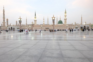 Wall Mural - Muslim pilgrims visiting the beautiful Nabawi Mosque, The view of the retractable roof An Nabawi Mosque.