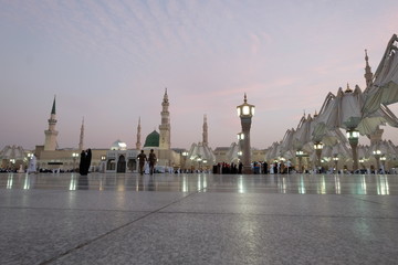 Wall Mural - Muslim pilgrims visiting the beautiful Nabawi Mosque, The view of the retractable roof An Nabawi Mosque.