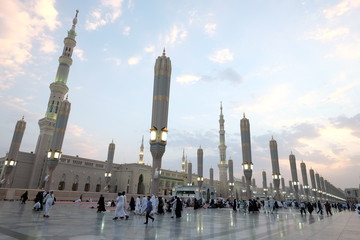 Wall Mural - Muslim pilgrims visiting the beautiful Nabawi Mosque, The view of the retractable roof An Nabawi Mosque.