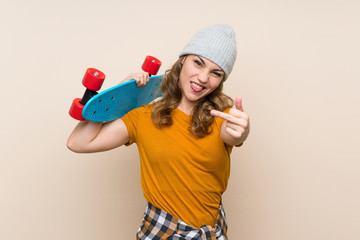 Wall Mural - Young skater blonde girl over isolated background