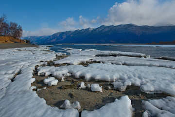 Wall Mural - Russia. Mountain Altai. Southern shore of lake Teletskoye near the mouth of the river Chulyshman