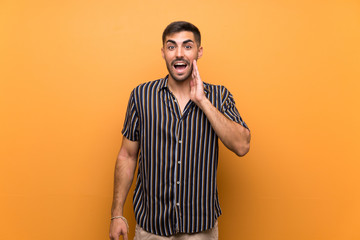 Wall Mural - Handsome man with beard over isolated background with surprise and shocked facial expression