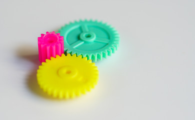 Colorful gears on a white background ,concept of work process movement gears