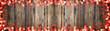 Valentine love background panorama banner long - Frame made of red bokeh lights and hearts isolated on rustic brown texture. top view with space for text
