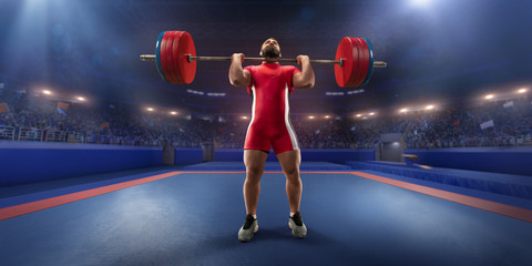 Male athlete is lifting a barbell on a professional stadium. Stadium and crowd are made in 3d.