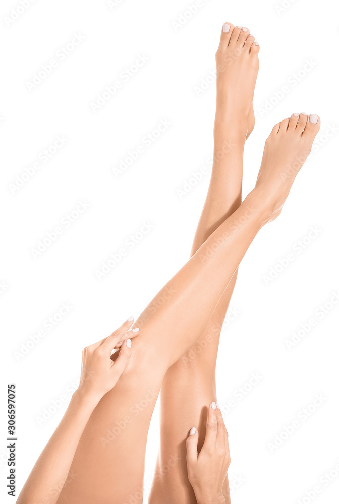 Woman with beautiful legs after depilation on white background