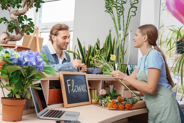 Sticker - Customer paying for order in flower shop