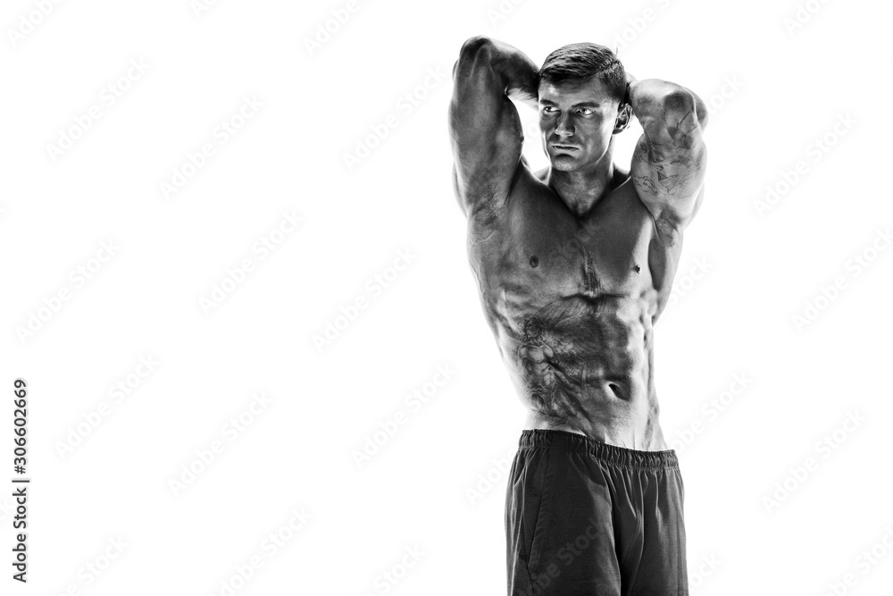 Tattooed muscular super-high level handsome man posing in studio isolated on white background - obrazy, fototapety, plakaty 