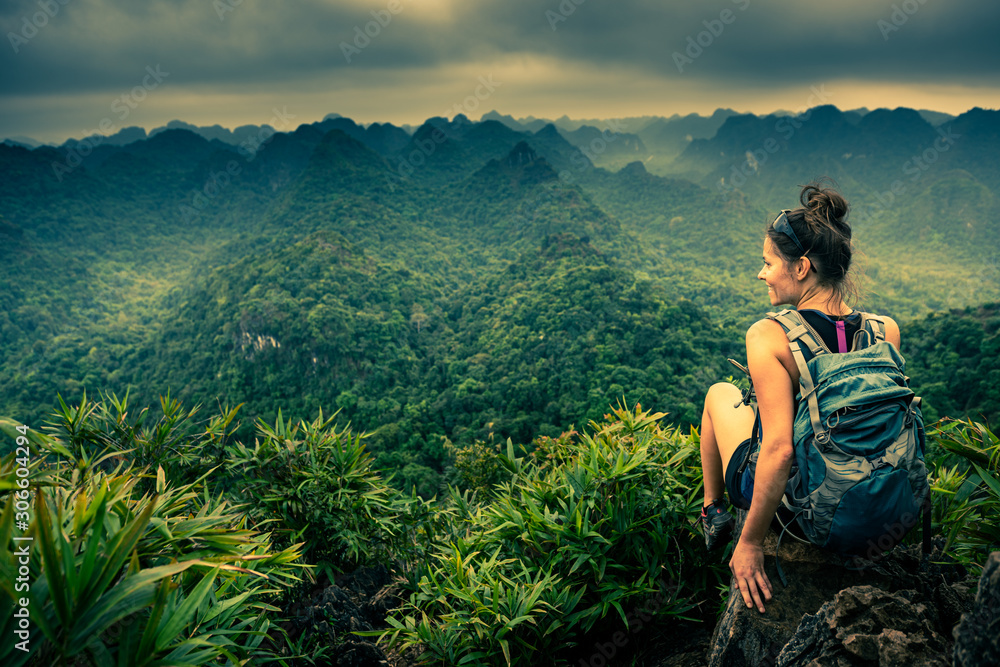 Cat Ba National Park Top of the Hill Young Woman enjoys beautiful view from the Ngu Lam peak in Kim Giao forest, - obrazy, fototapety, plakaty 