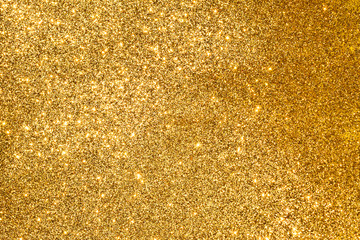 Wall Mural - sparkles of golden glitter abstract background	