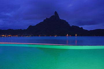 Wall Mural - Night view of the Mont Otemanu mountain  seen from the Meridien Bora Bora resort over the lagoon in French Polynesia, South Pacific