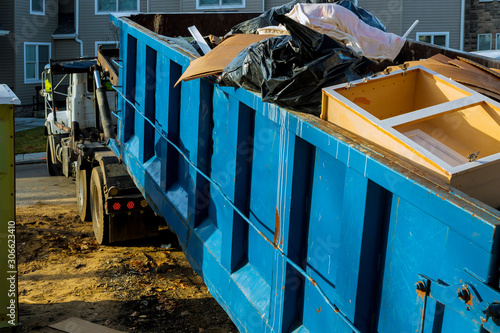 Fotomural Dumpster, recycle waste and garbage bins near new construction site of appartmen