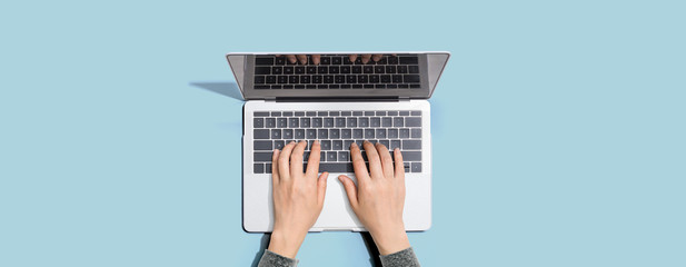 Wall Mural - person using a laptop computer from above
