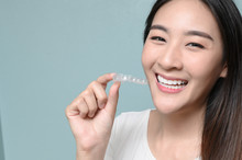 Woman Wearing Orthodontic Silicone Trainer. Mobile Orthodontic Appliance For Dental Correction. Tooth Whitening Systems.