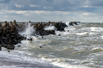 Wall Mural - Liepaja port north breakwater in storm.