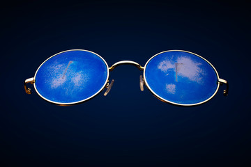 Poster - round scratched sunglasses in metal frame isolated on black