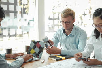 user experience UX designer designing web on smart phone layout. UI developer planning working on mobile application prototype