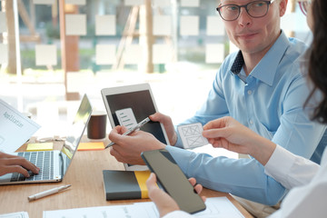 user experience UX designer designing web on smart phone layout. UI developer planning working on mobile application prototype